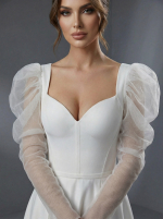 Классический А-силуэт с акцентированной талией, плавно расширяющейся юбкой и пышными рукавами-буфами (или «фонариками») — изображение 3