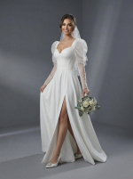 Классический А-силуэт с акцентированной талией, плавно расширяющейся юбкой и пышными рукавами-буфами (или «фонариками»)